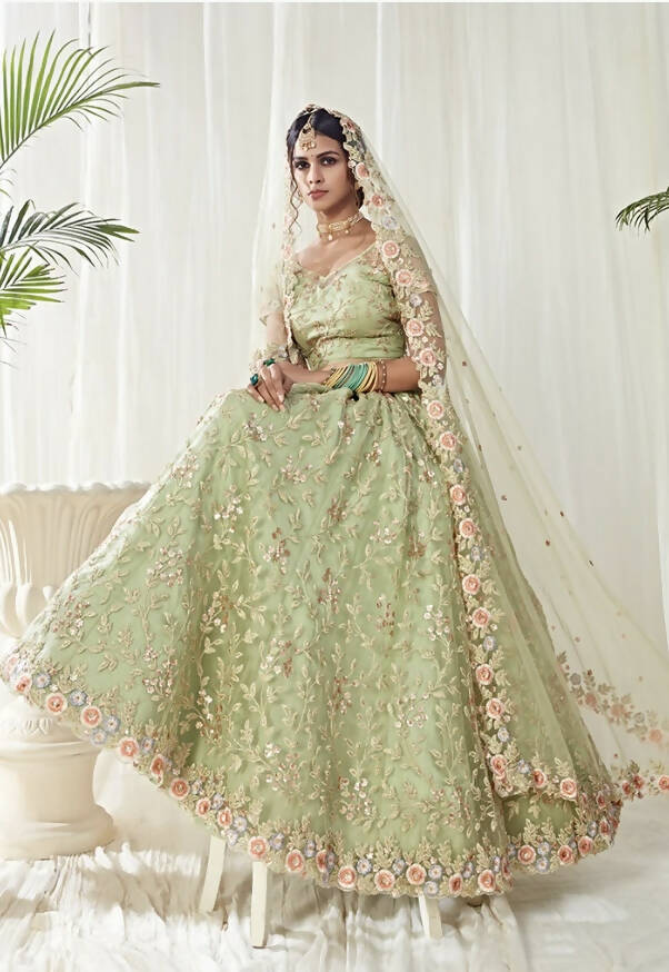 Light Green Floral Embroidered Net Lehenga features a net embroidered blouse with sequence, multicolored threads and cut dana work, comes half sleeves.