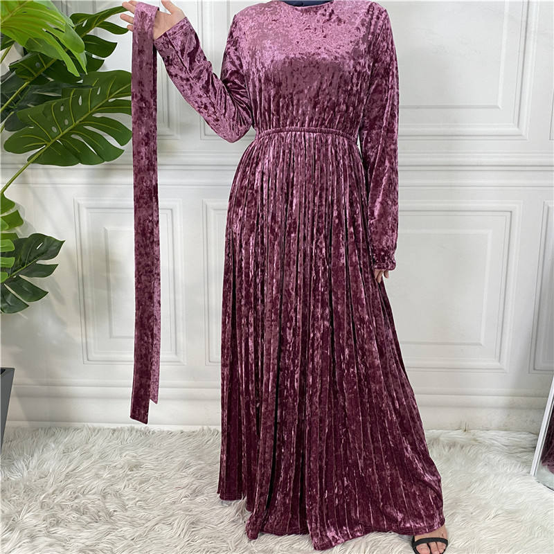 This beautiful pleated velvet dress is the perfect outfit for your next dinner, gathering, or party this fall winter season. 