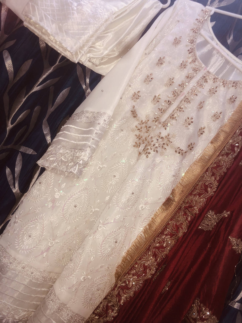 Look absolutely stunning with this georgette Heavy Embroidery Top with precise handwork  and premium pearls!