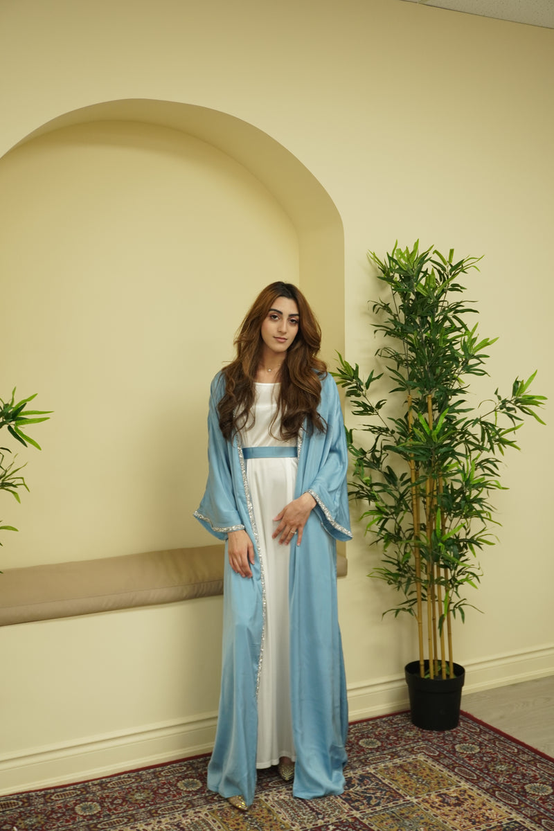 The Samira Satin Diamond Embellished Maxi Abaya Set is our new favorite 2 piece maxi abaya set! Made with a high quality satin fabric, it includes a white satin inner dress, a diamond embellished maxi abaya in 3 colors, and a matching belt.
