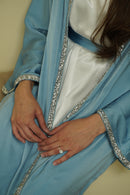 The Samira Satin Diamond Embellished Maxi Abaya Set is our new favorite 2 piece maxi abaya set! Made with a high quality satin fabric, it includes a white satin inner dress, a diamond embellished maxi abaya in 3 colors, and a matching belt.