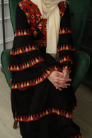 The Modern Red Tatreez Embroidered Layered Ruffles Palestinian Thobe is a beautiful dress for a special occasion! It is simple, elegant and perfect for the next Palestinian katib ktab or wedding. This Thobe has a layered design and includes a belt with tatreez!