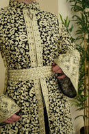 Our Bridal Floral Beaded Embroidered Palestinian Kaftan Thobe is a beautiful dress for your special occasion! It is luxerious, elegant and perfect for your Palestinian katib ktab or wedding. It is a dress with beautiful floral tatreez, embedded pearls and jewels and a tatreez belt that can be adjusted as you wish!