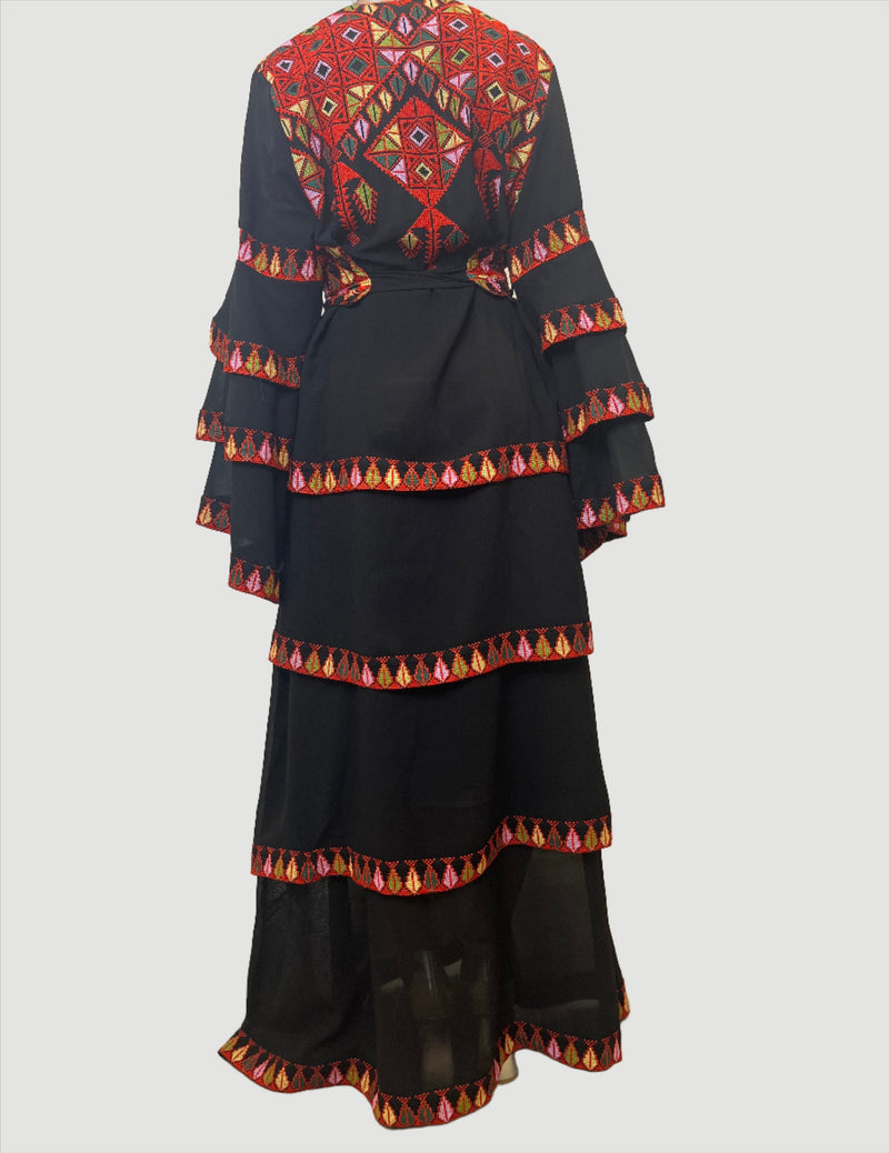 The Modern Red Tatreez Embroidered Layered Ruffles Palestinian Thobe is a beautiful dress for a special occasion! It is simple, elegant and perfect for the next Palestinian katib ktab or wedding. This Thobe has a layered design and includes a belt with tatreez!