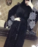 Look luxurious in this beautiful black abaya! It has diamond work on the sleeves and bottom as well as a belt in the middle.