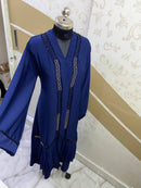 Blue zoom abaya with precise golden and black diamond work handcrafted carefully on premium zoom fabric, with frilled georgette in the bottom. 