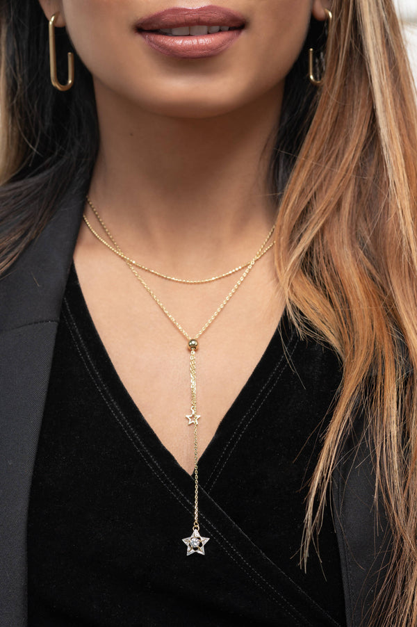 Women wearing Astral Shooting Star Necklace gold