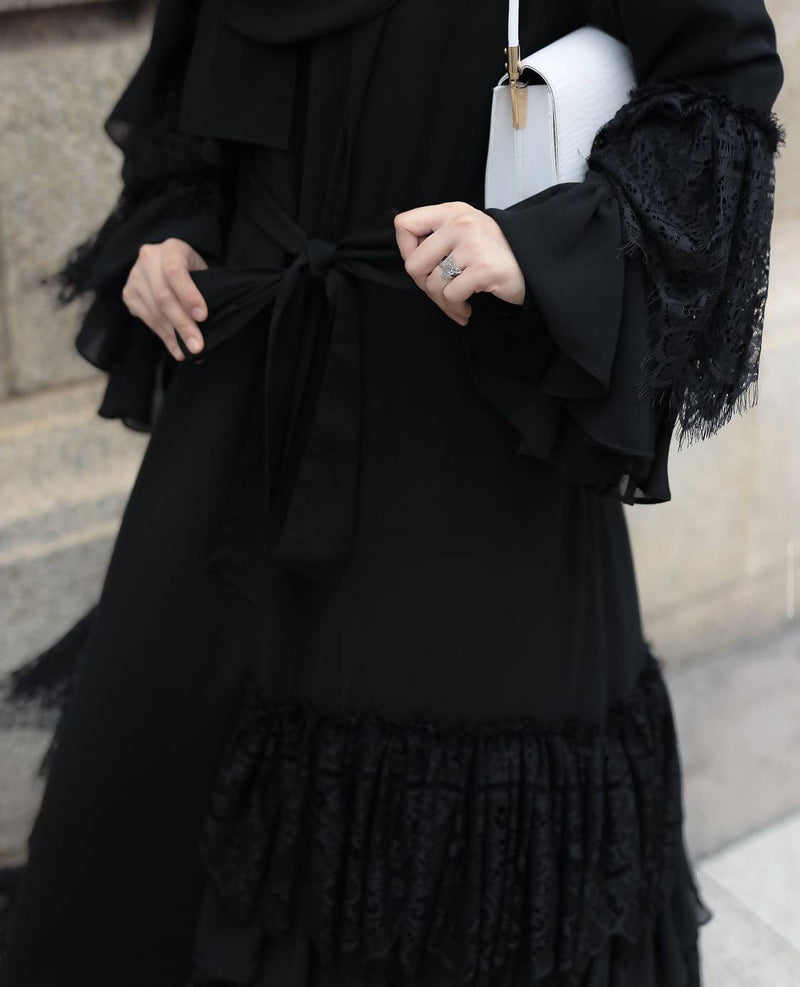 Grab this beautiful flared ruffle lace abaya! It is simple yet stylish.
