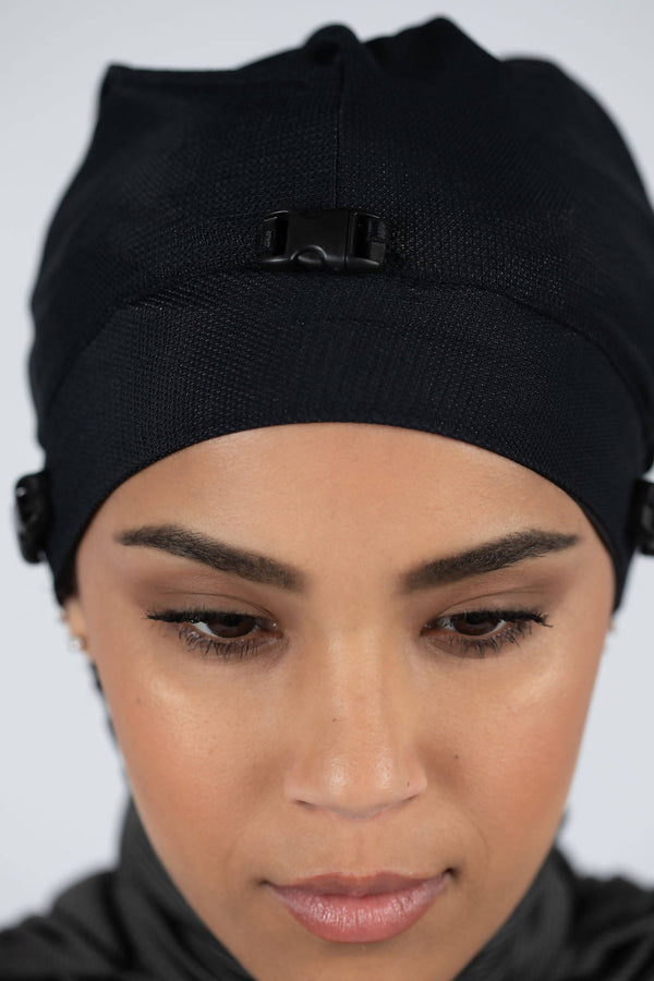 Women's black hijab under cap