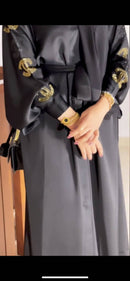 This kimono silhouette has been crafted from rich black Nida fabric with golden arabic and chanel embroidery.