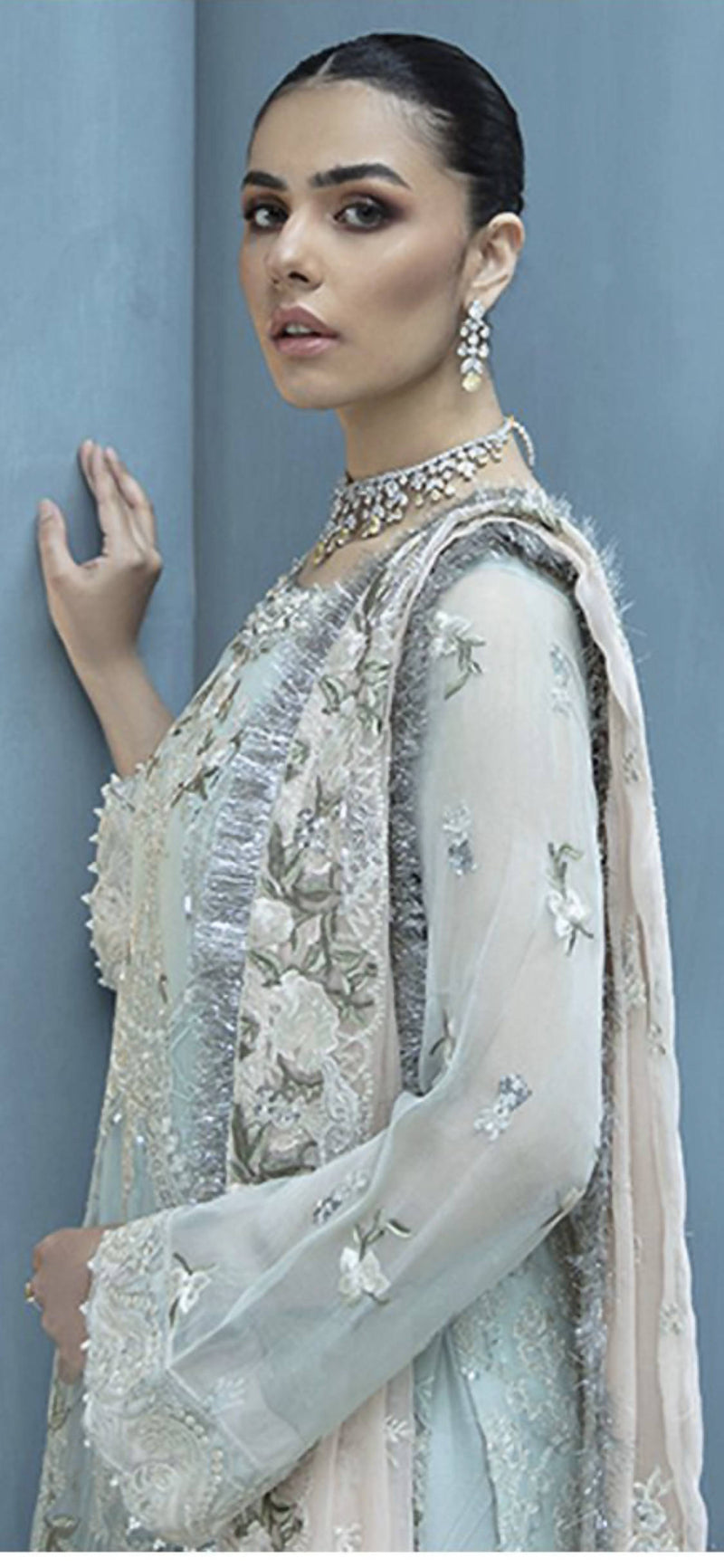 Feel glamorous in this fully embroidered heavy georgette suit with pearls, sequins, dorri work, and a crystal border neckline.