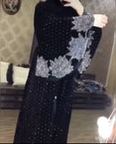 Look luxurious in this beautiful black abaya! It has diamond work on the sleeves and bottom as well as a belt in the middle.