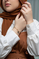 Woman wearing Moon & Star Link bracelet on wrist