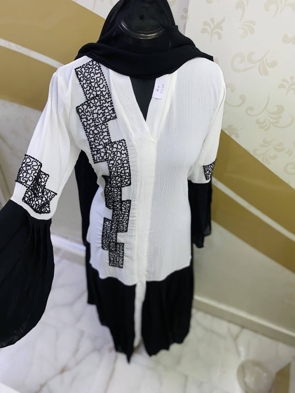 Look elegant in this beautiful white cye crush abaya, with handcrafted diamond work details