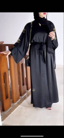 This kimono silhouette has been crafted from rich black Nida fabric with golden arabic and chanel embroidery.