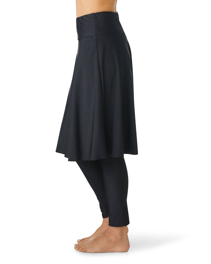 Sideview women's black swim skirt with attached leggings