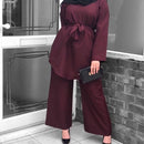 2 piece cord-set features an ultra soft mid-thigh length tunic with an adjustable tie waist belt and mega flattering wide leg pants with soft pleats along the waistline. 