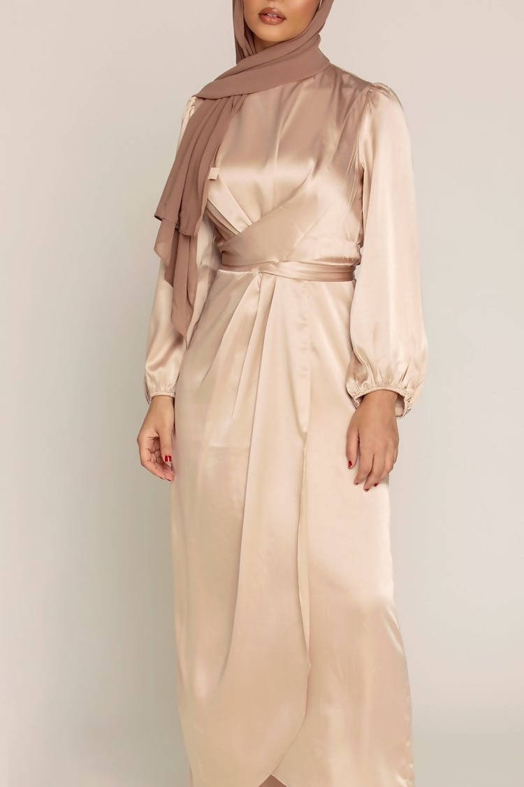 This exclusive modest gown features an elegant tie neckline with a fit and flare silhouette, crafted in premium Satin Nida, a quality, durable material.