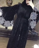 Look luxurious in this beautiful black abaya! It has diamond work on the sleeves and bottom as well as a belt in the middle.