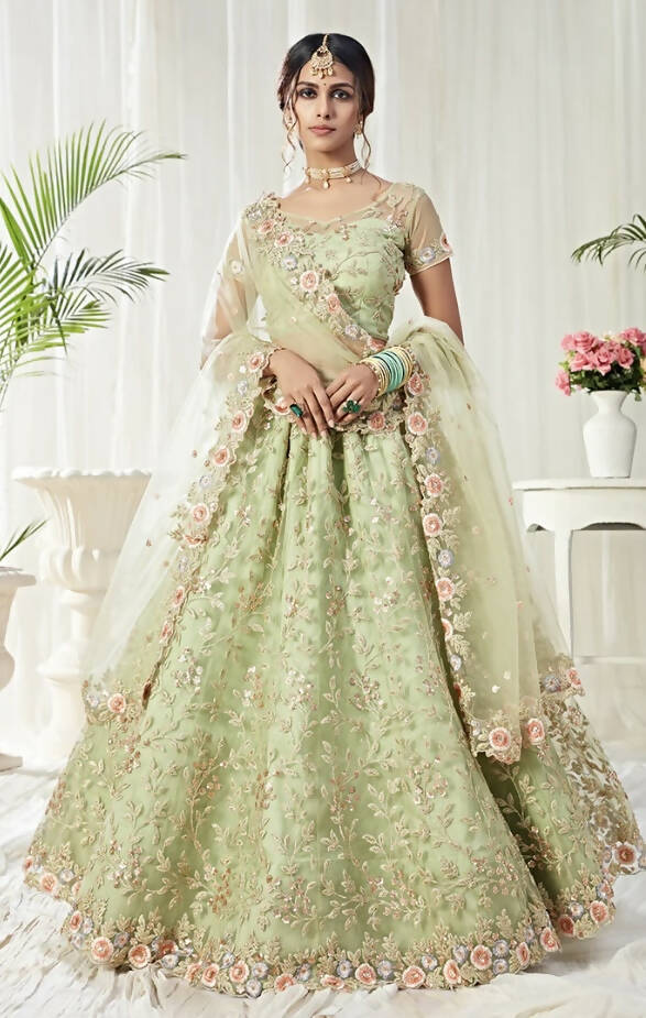 Light Green Floral Embroidered Net Lehenga features a net embroidered blouse with sequence, multicolored threads and cut dana work, comes half sleeves.