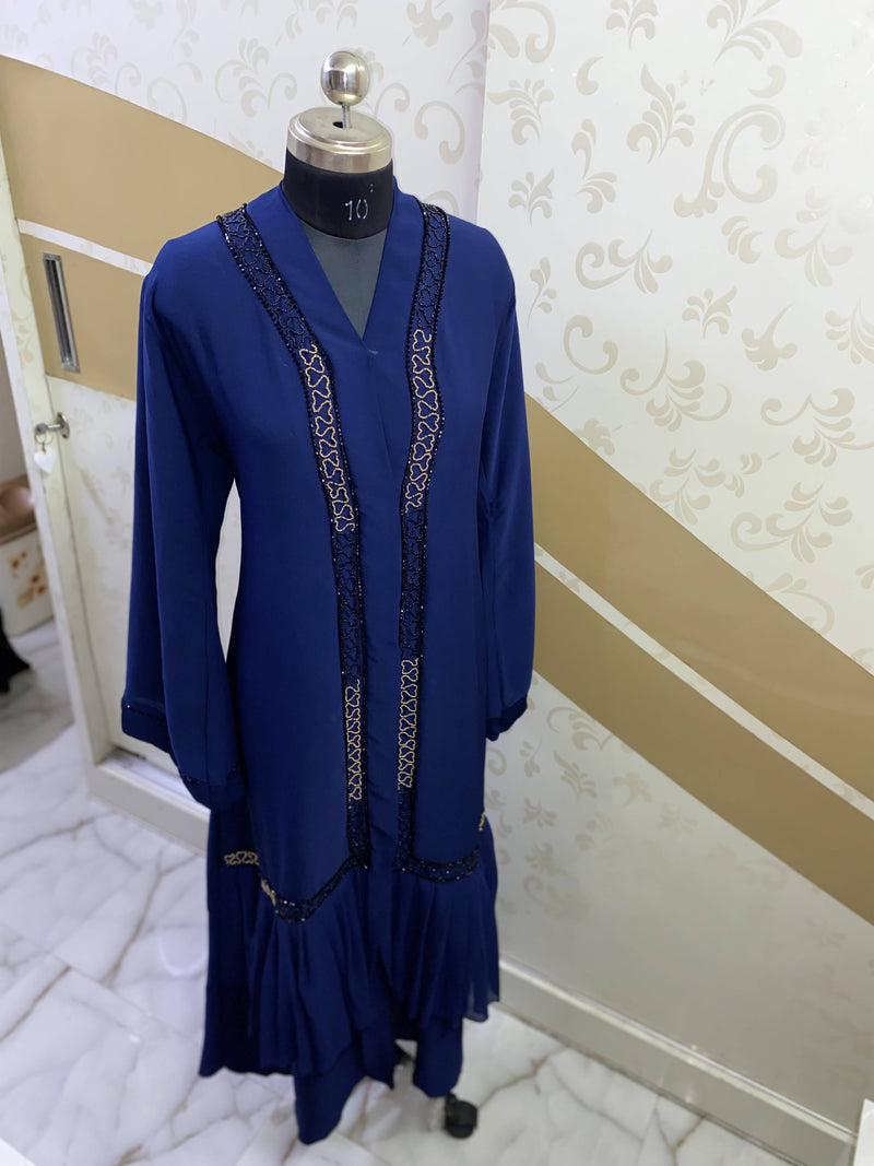 Blue zoom abaya with precise golden and black diamond work handcrafted carefully on premium zoom fabric, with frilled georgette in the bottom. 
